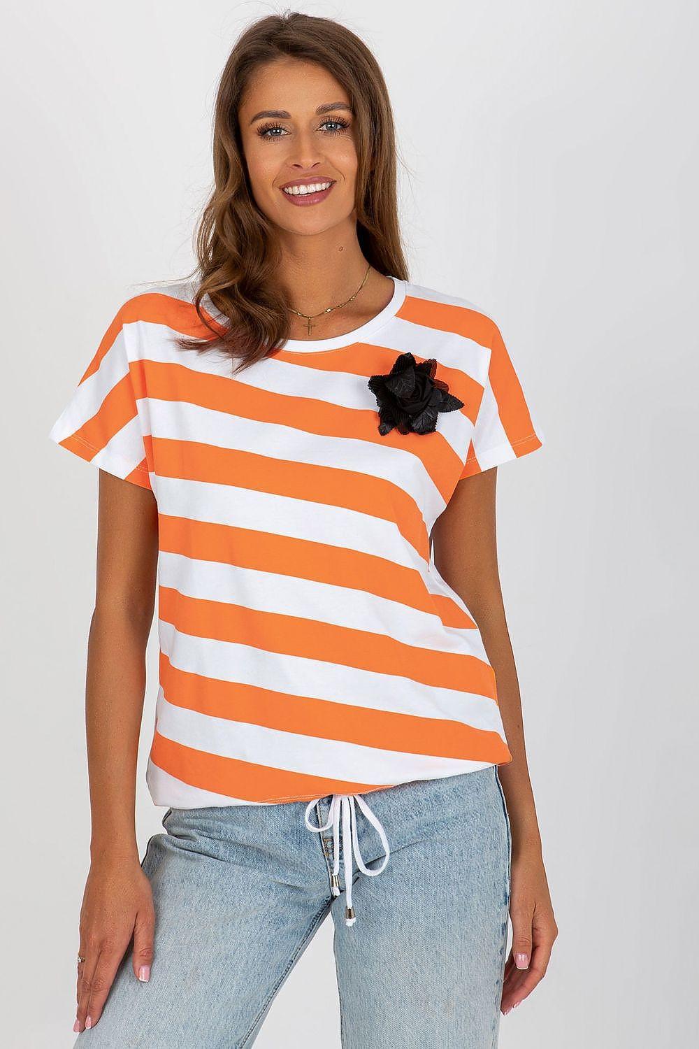 Striped blouse with orange and white bands, black floral brooch accent