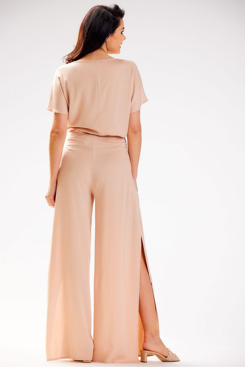 awama women’s trousers in beige, wide-leg with side slit, back view