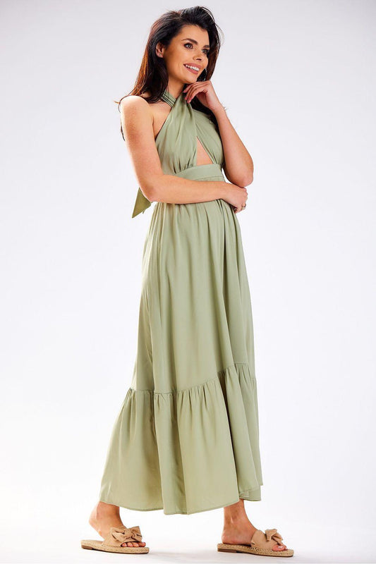 Green halter day dress with tiered skirt, sleeveless design