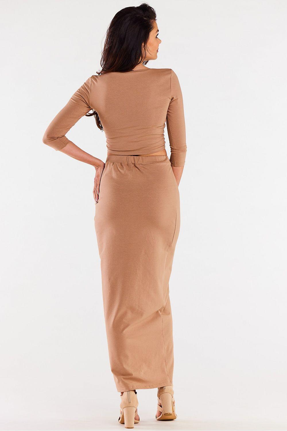 Beige maxi skirt, back view, gathered waist and center leg slit