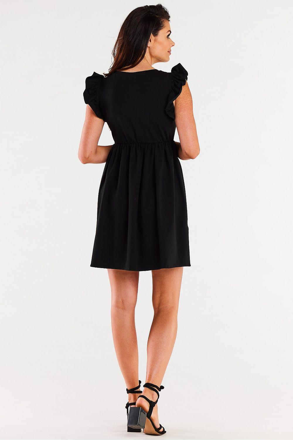 Black daydress with ruffled shoulders and gathered waist, back view