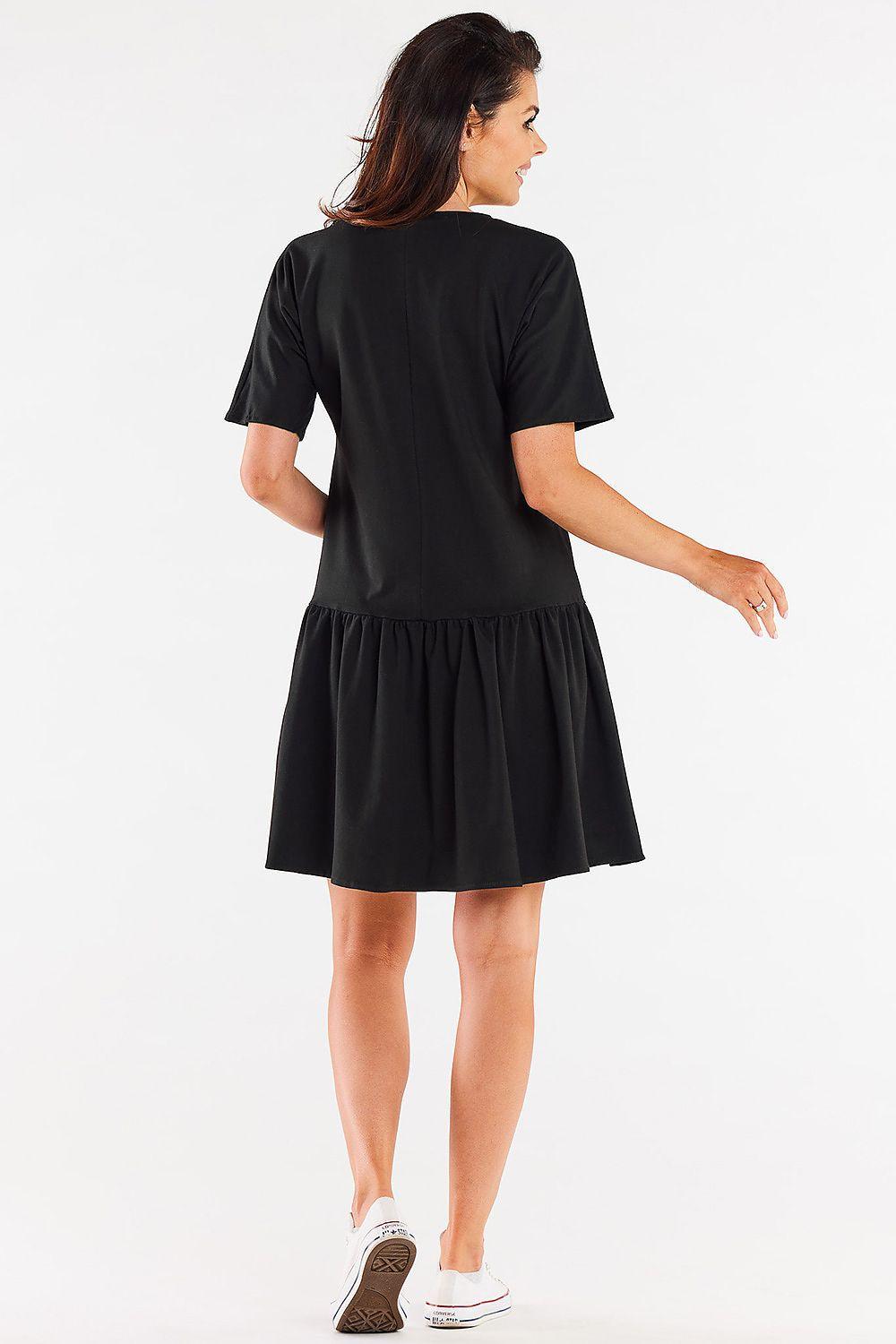 Black daydress back view with short sleeves and gathered waist tiered skirt