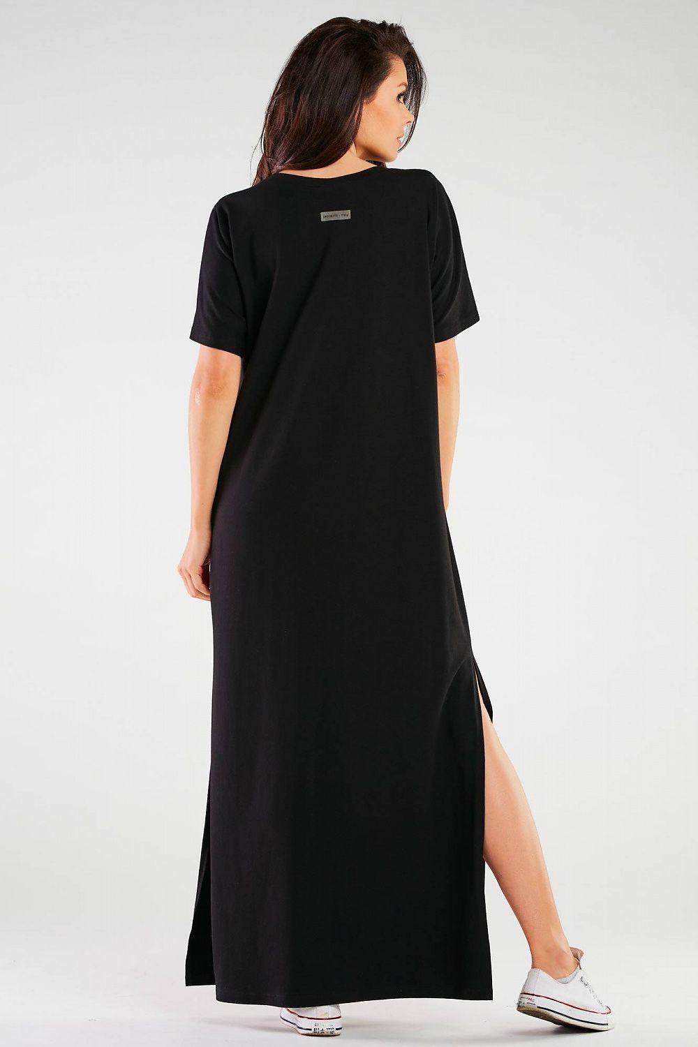 Black maxi day dress shown from the back with short sleeves and side slit
