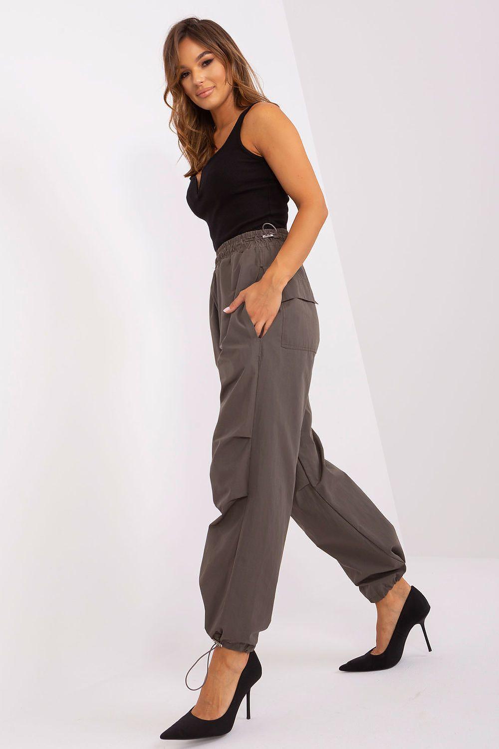 Women’s trousers dark gray with elastic waist, roomy legs and side pockets; full-body view