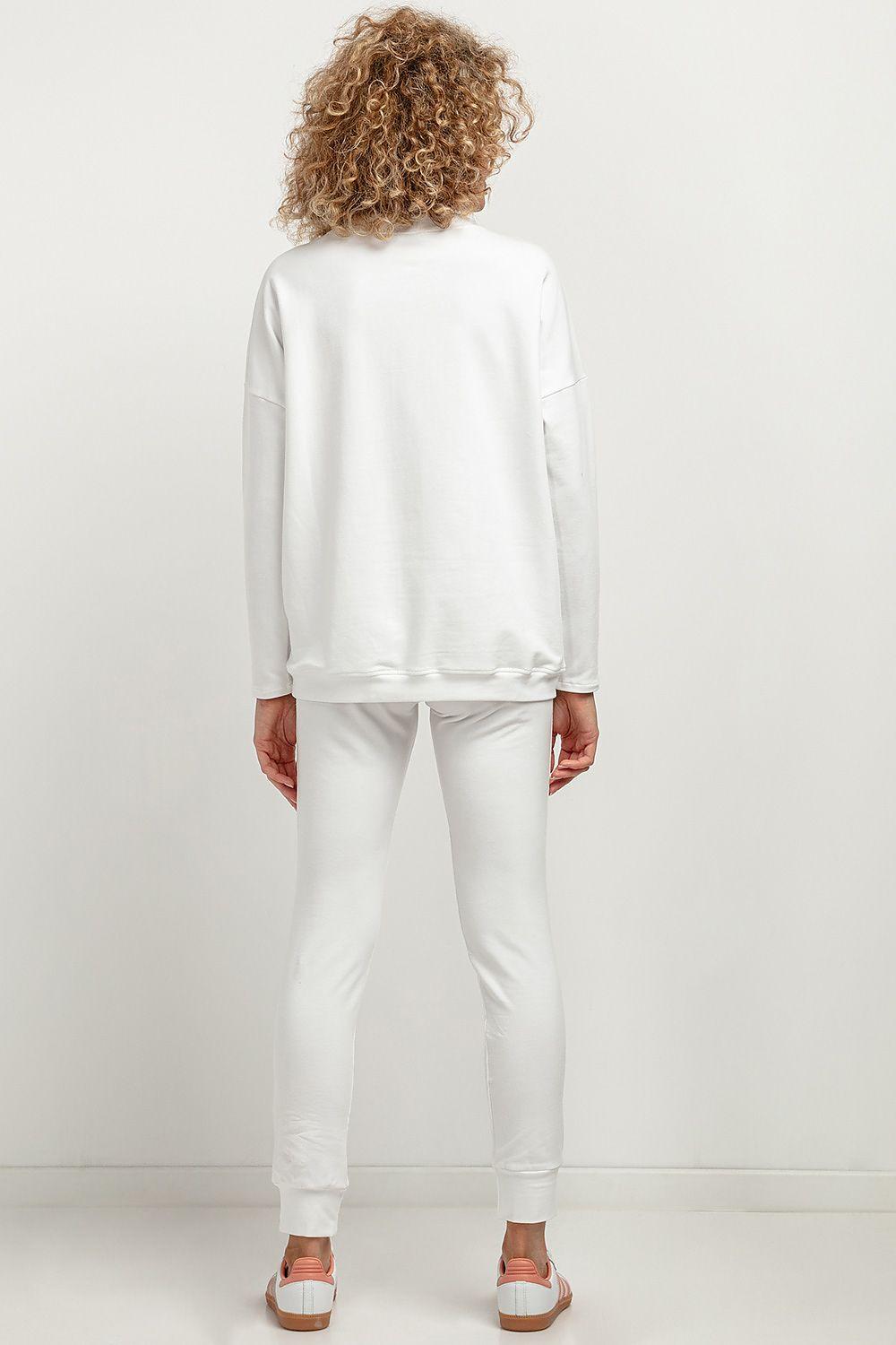 White knit tracksuit trousers, back view, with elastic waist and tapered legs