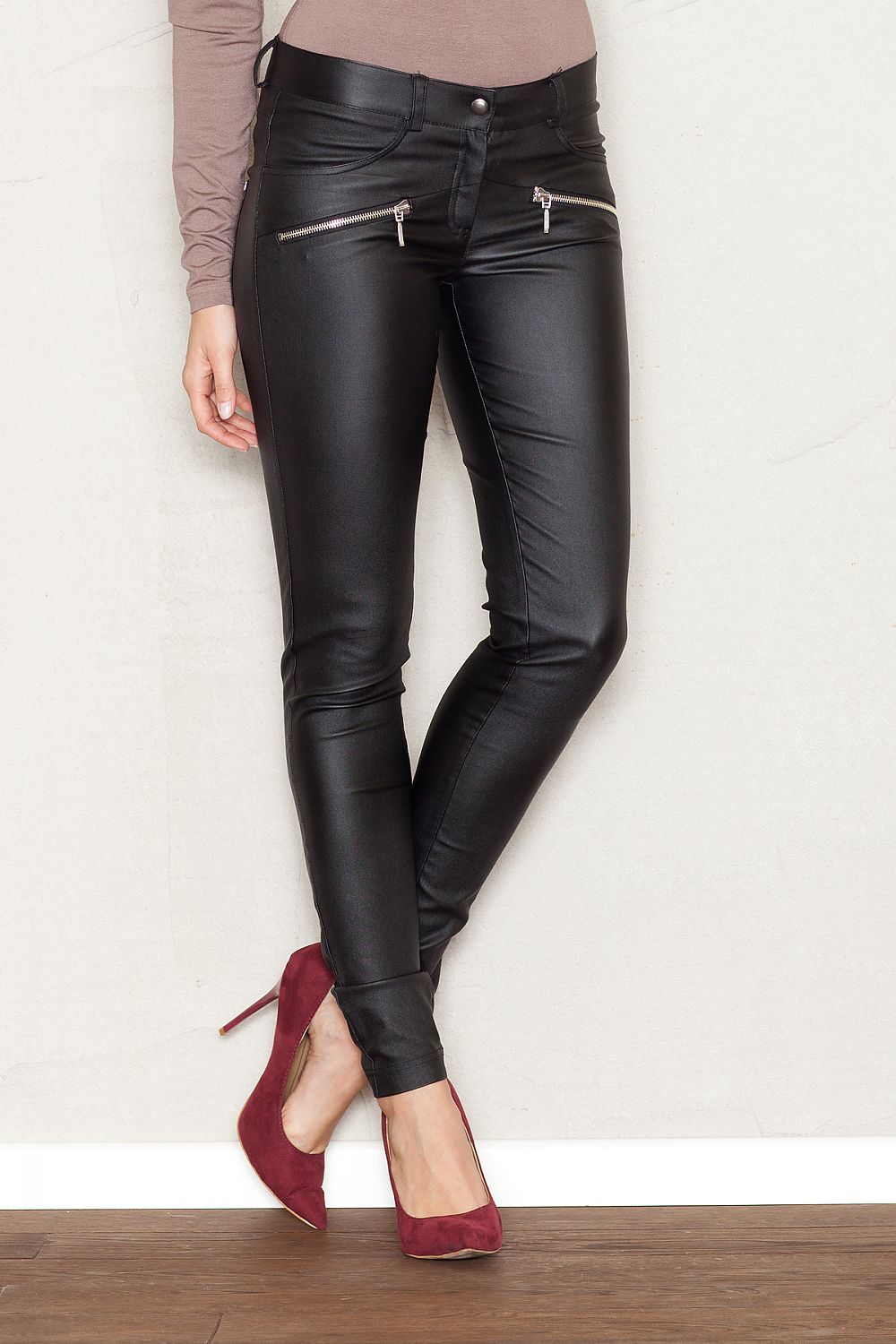 Black slim fit trousers with zip fly and side pockets, faux leather finish