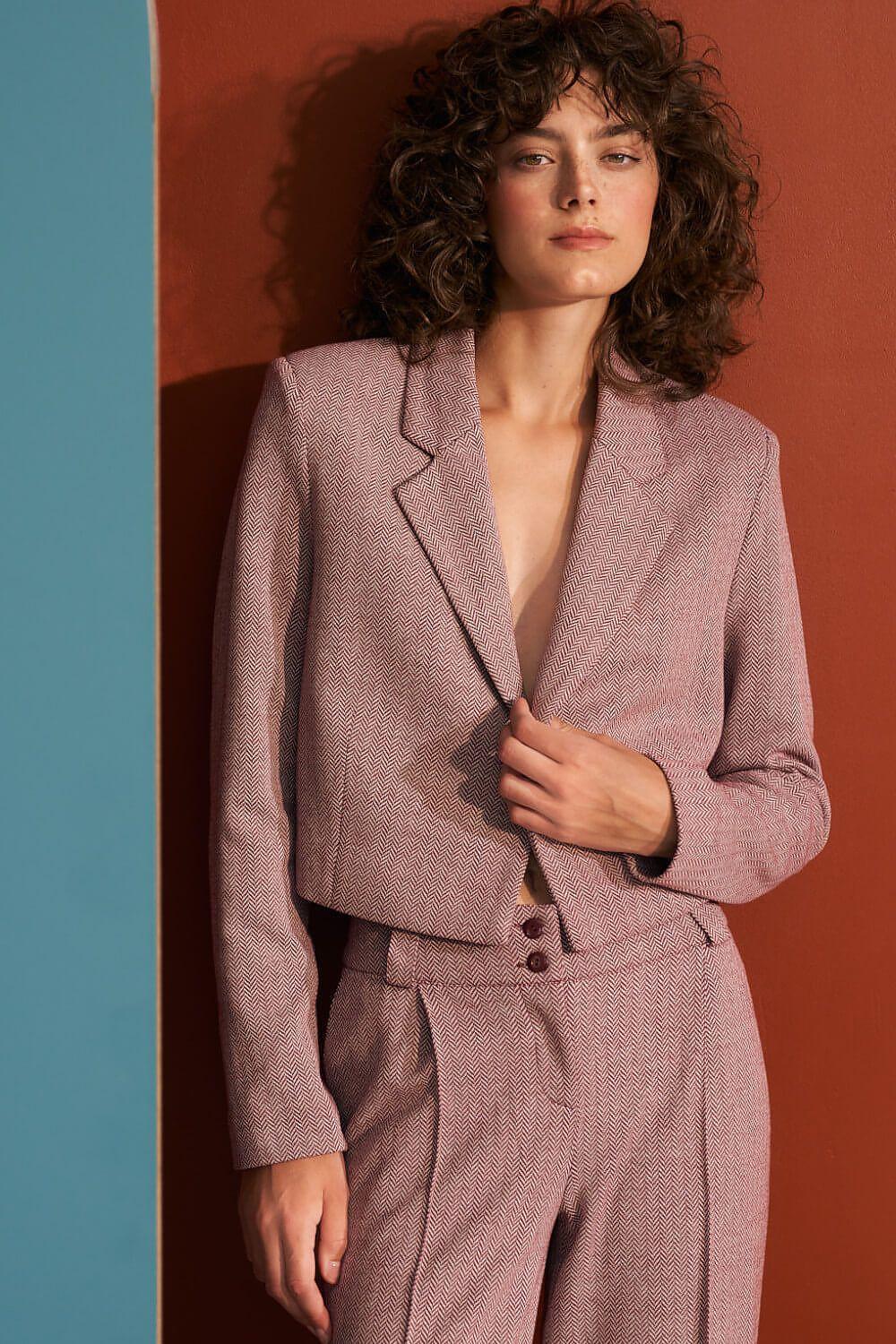 Short blazer jacket in mauve with notch lapels, buttoned front, and flap pocket