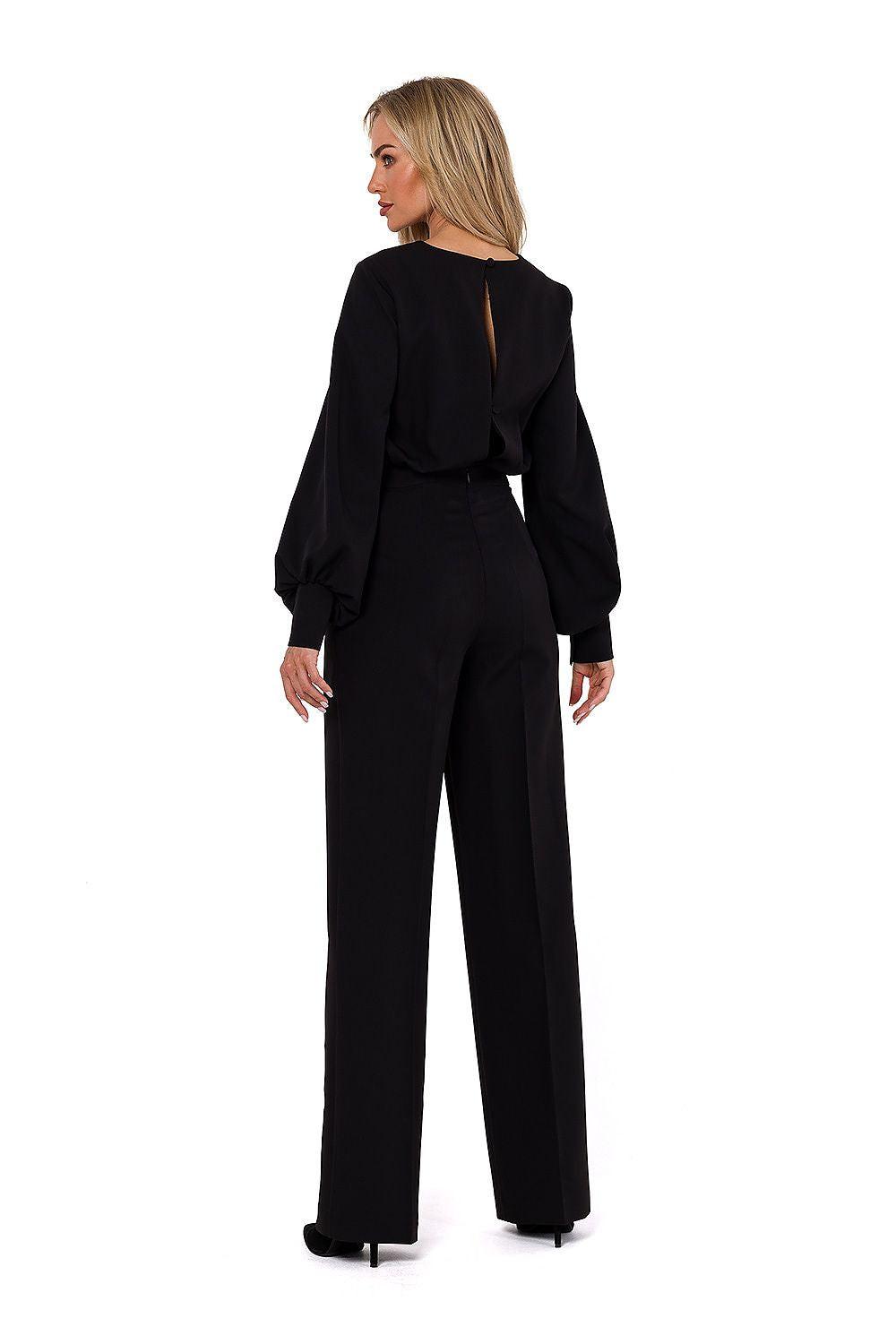 Women’s black pantsuit with long sleeves, wide-leg trousers, and back keyhole cutout