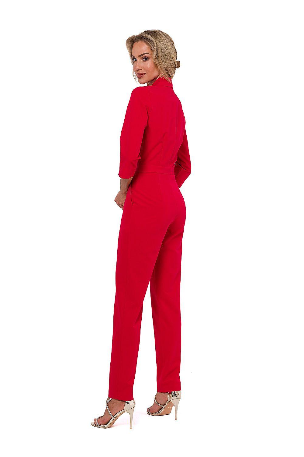 Red V-neck jumpsuit with belt, side view, tapered pants