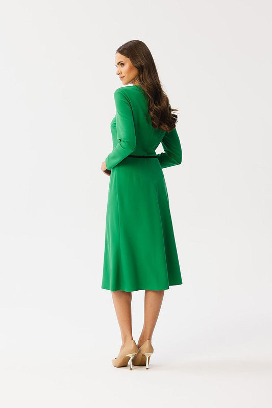 Green long-sleeve day dress with waist belt and pleated front, midi length.