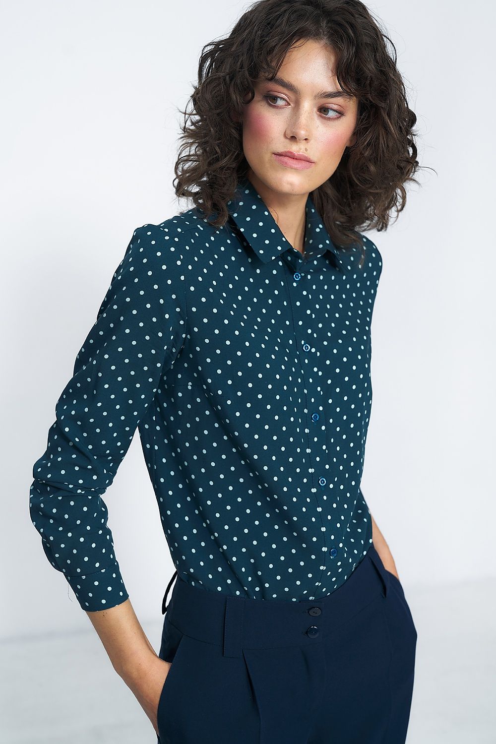 Dark green polka dot viscose shirt with pointed collar and button placket