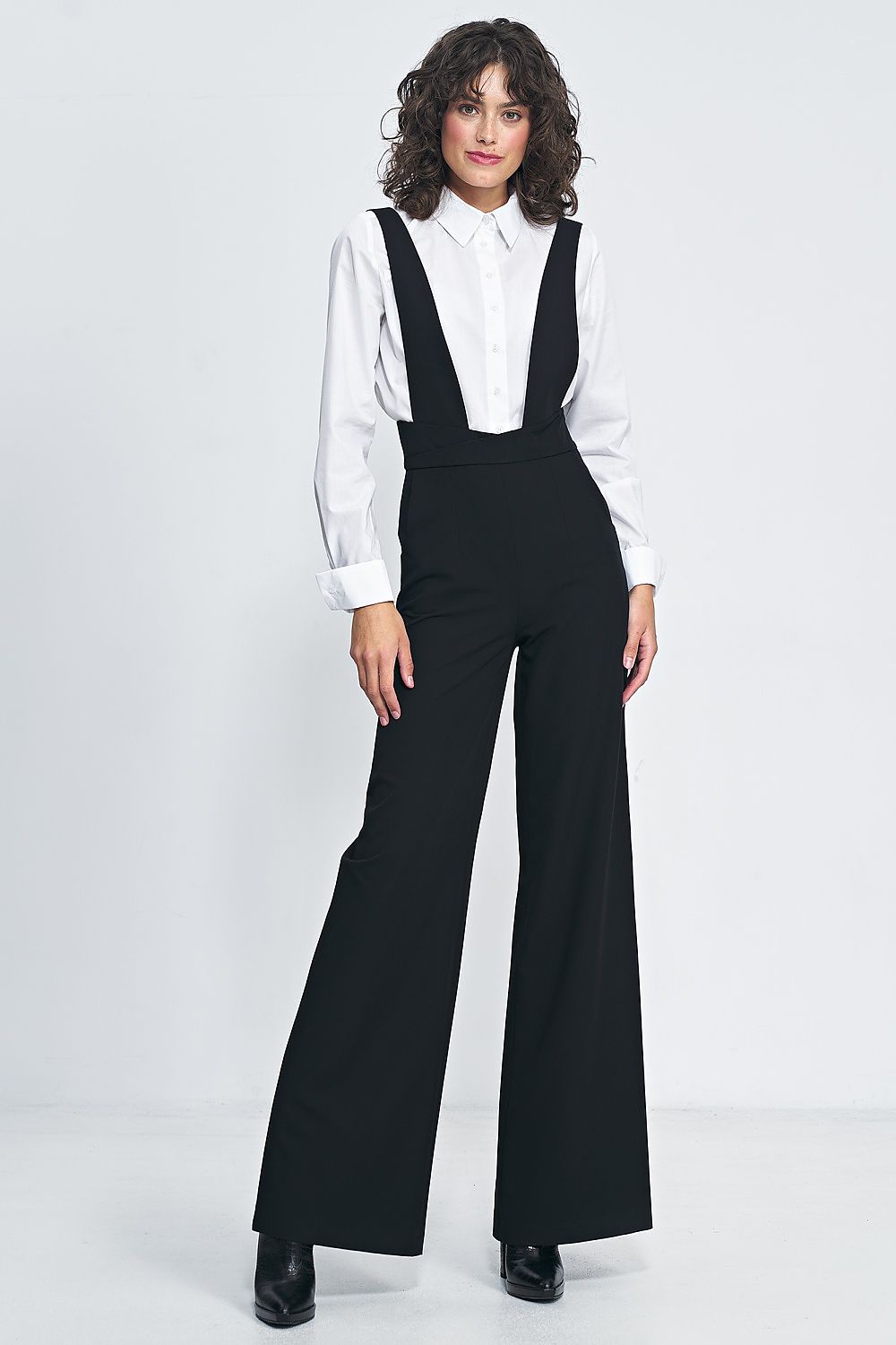 Black high-waisted jumpsuit with wide legs and suspender straps