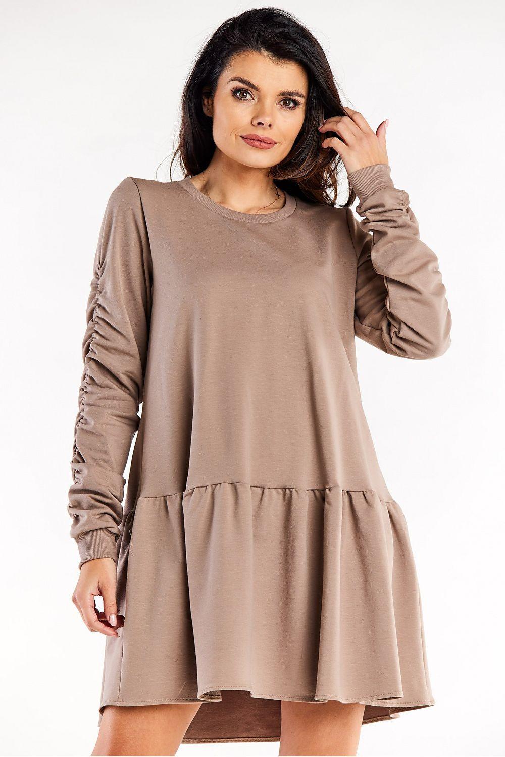 Beige long-sleeve daydress with round neck and tiered skirt hem