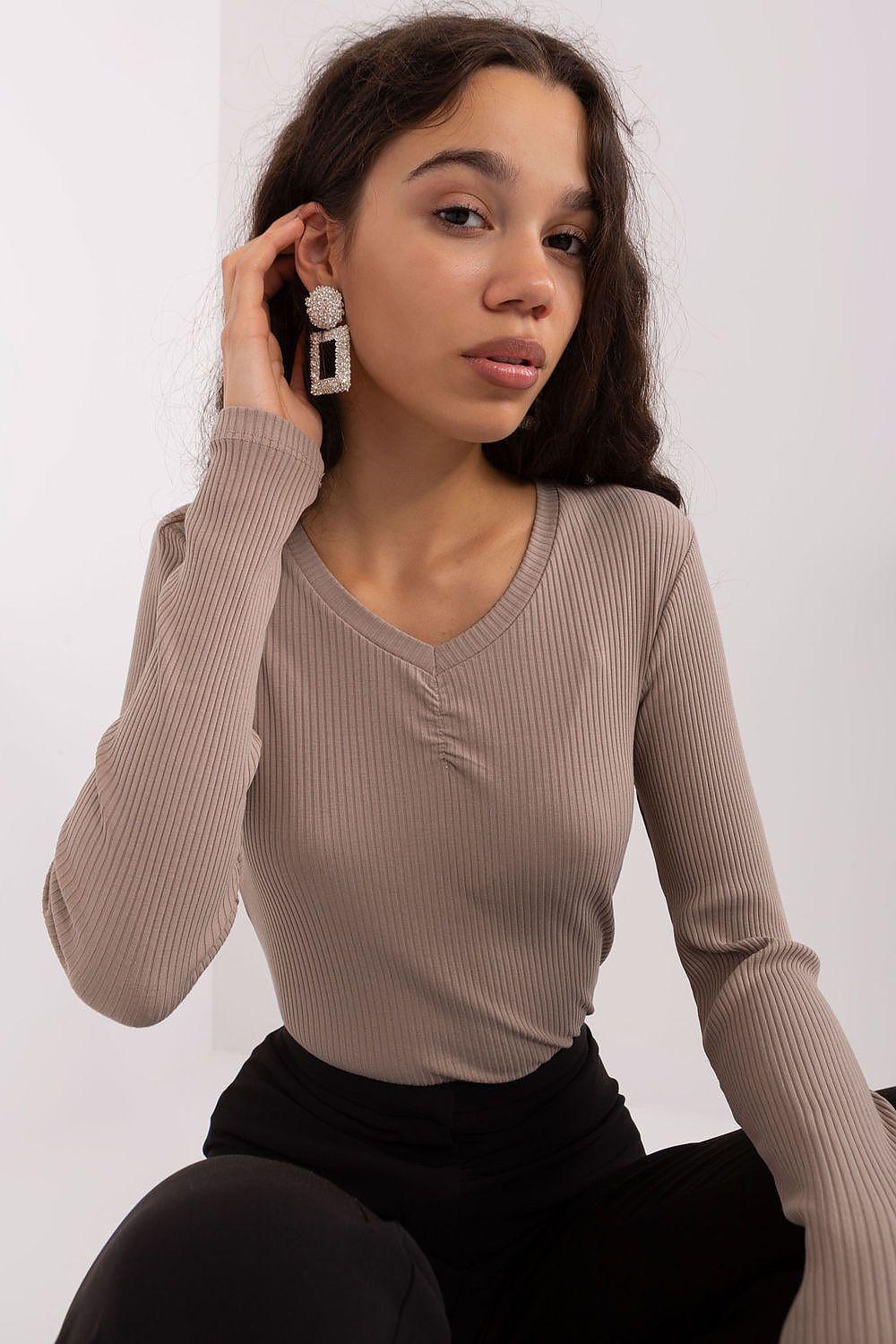 Beige ribbed knit blouse with V-neck and long sleeves, fitted