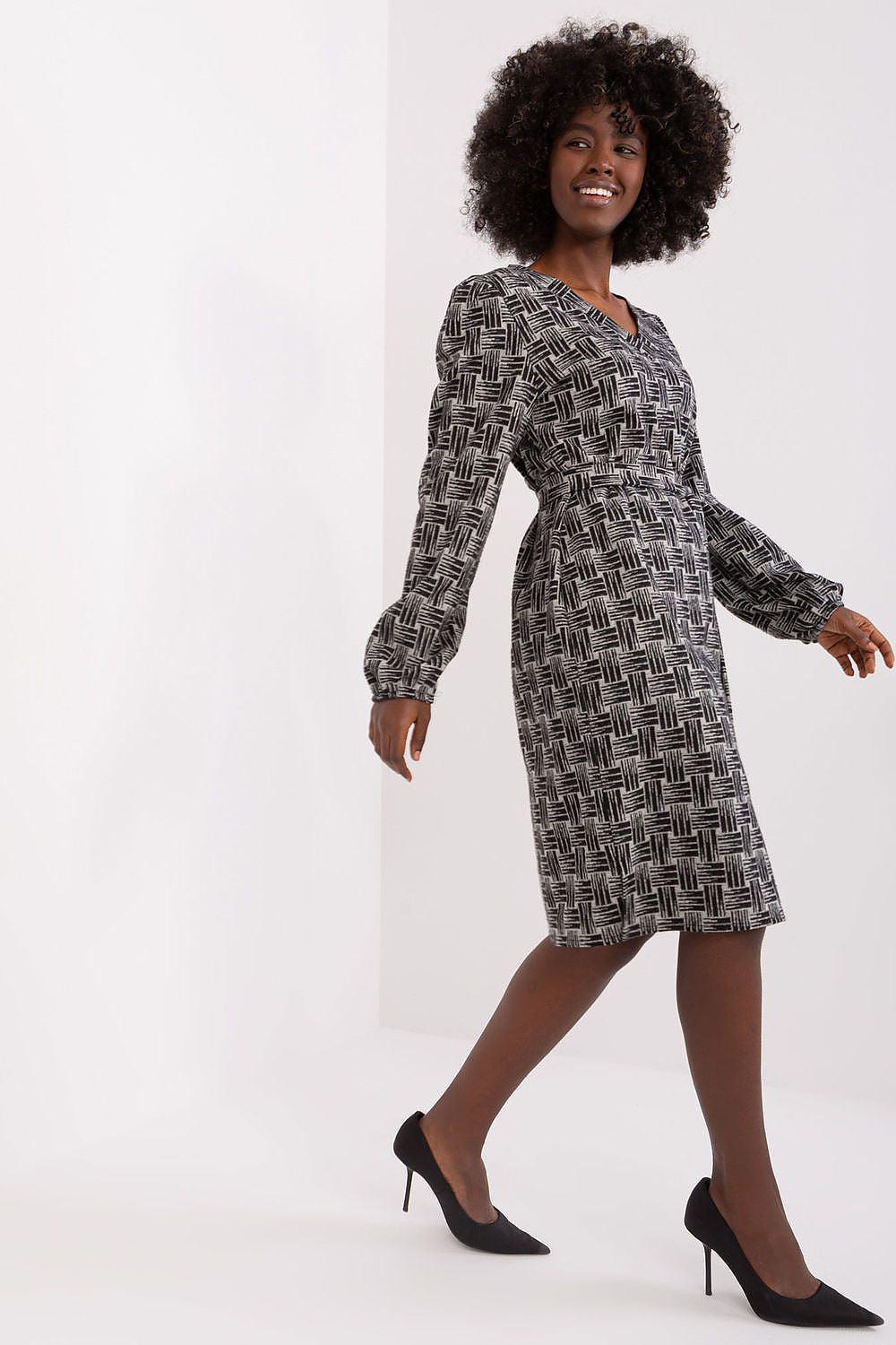 Dark geometric long-sleeve daydress with crew neck and straight knee-length hem
