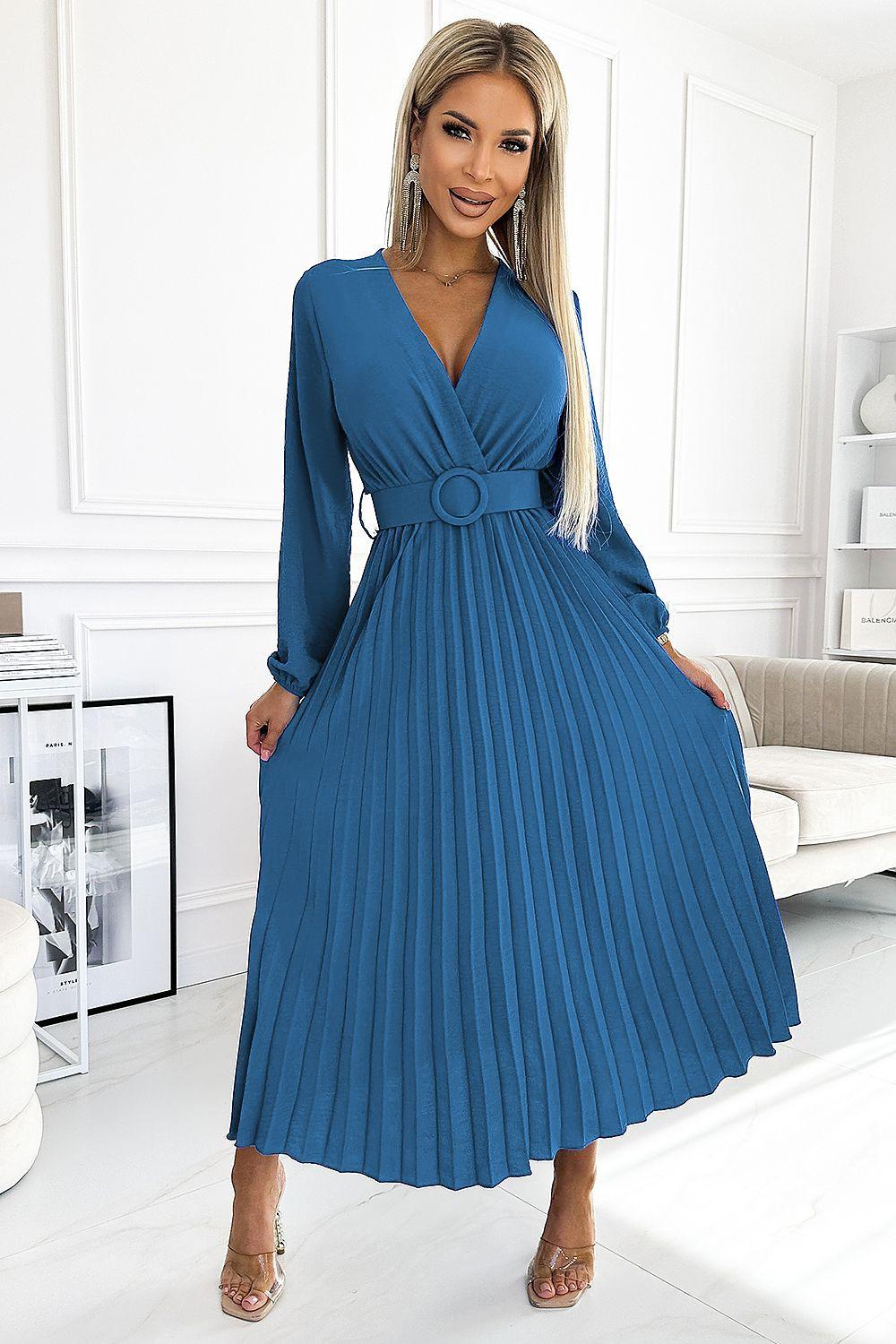 Blue pleated cocktail dress with V-neck, long sleeves, and waist belt with circular detail