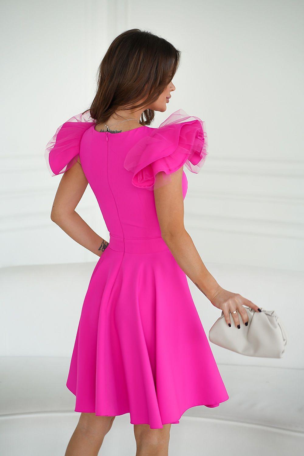 Pink cocktail dress, back view, with ruffled shoulder detail and flared pleated skirt