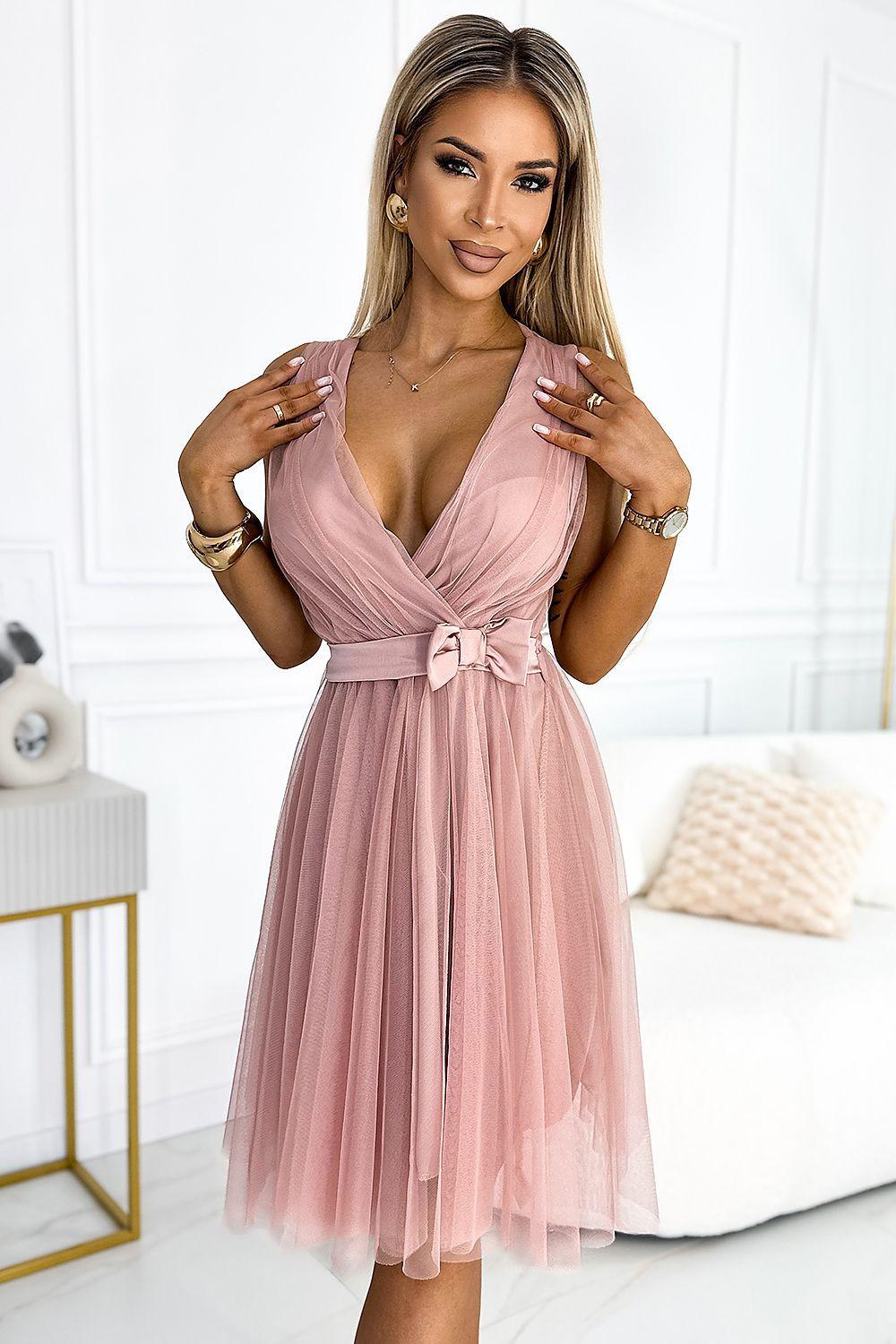 Pink tulle cocktail dress with satin bow at waist and deep V-neck bodice