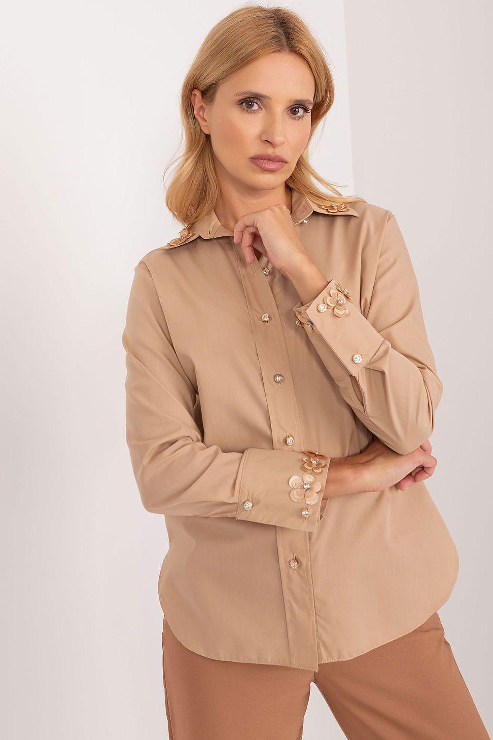Beige long-sleeve button-up shirt with pointed collar and decorative cuff trim