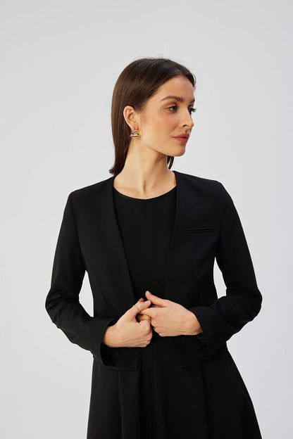 Black collarless short jacket with open front and chest pocket