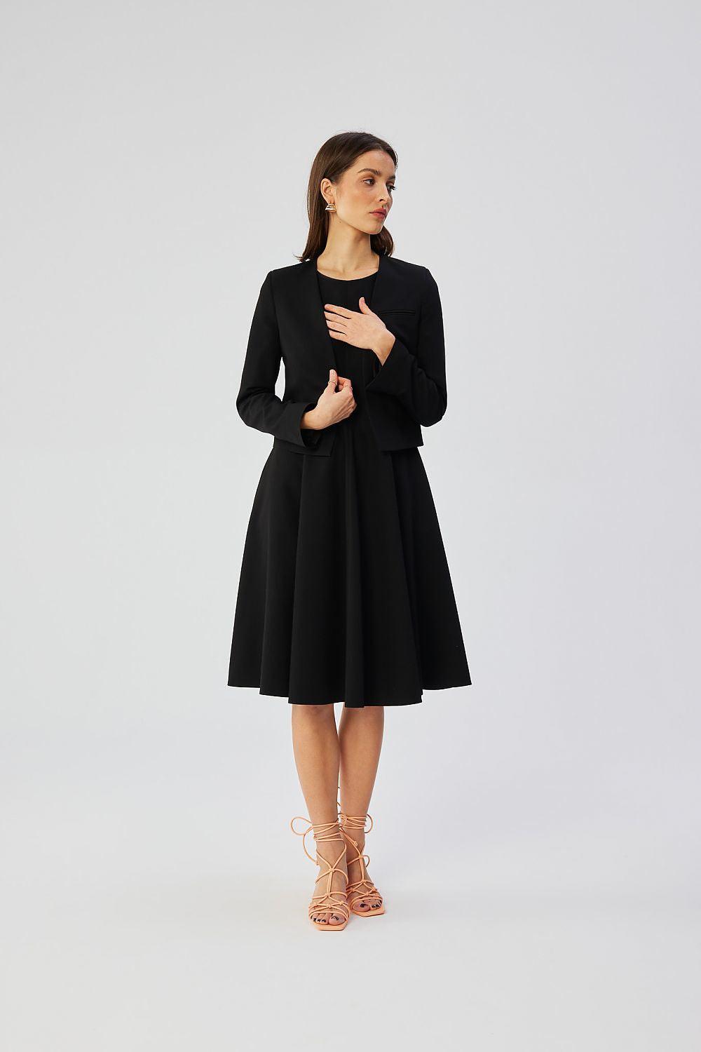 Black collarless short jacket, open front, flared skirt hem