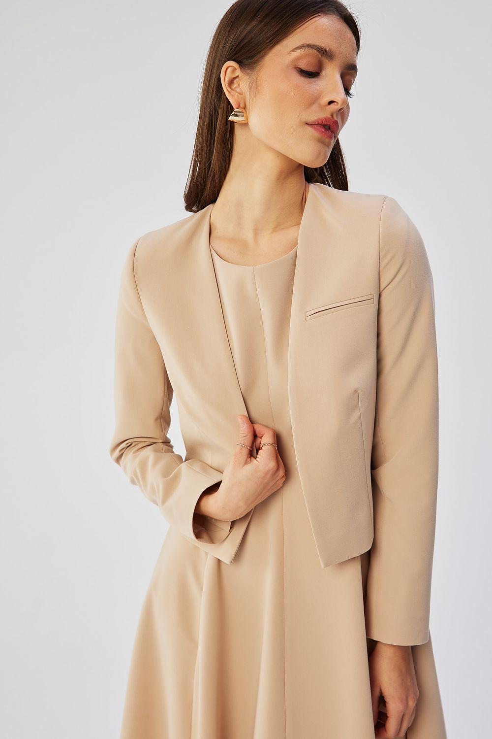 Beige collarless short jacket with open front and angled chest pocket