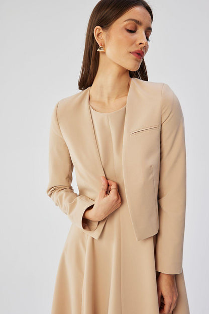 Beige collarless short jacket with open front and angled chest pocket