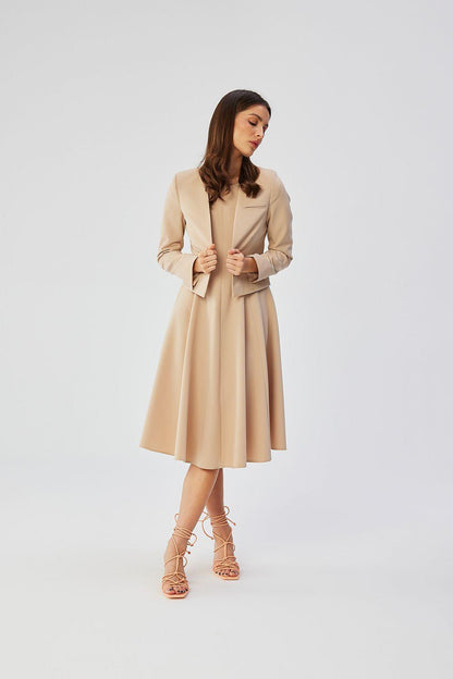 Beige collarless short jacket with open front and flared skirt hem