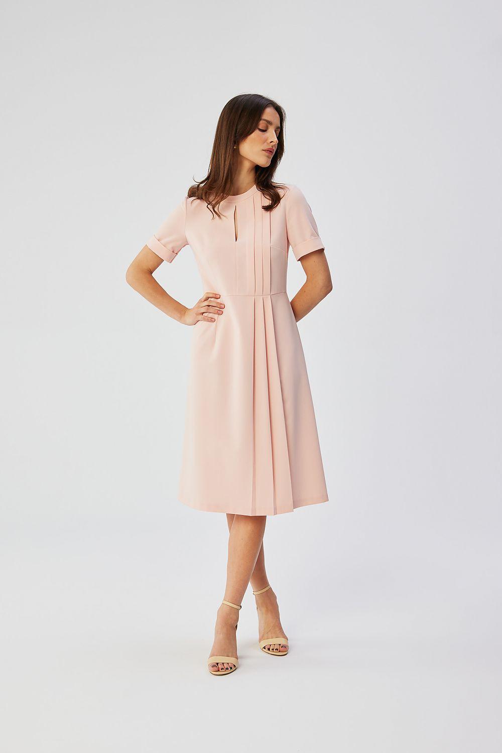 Blush pink pleated waist cocktail dress with short sleeves and vertical seam detail