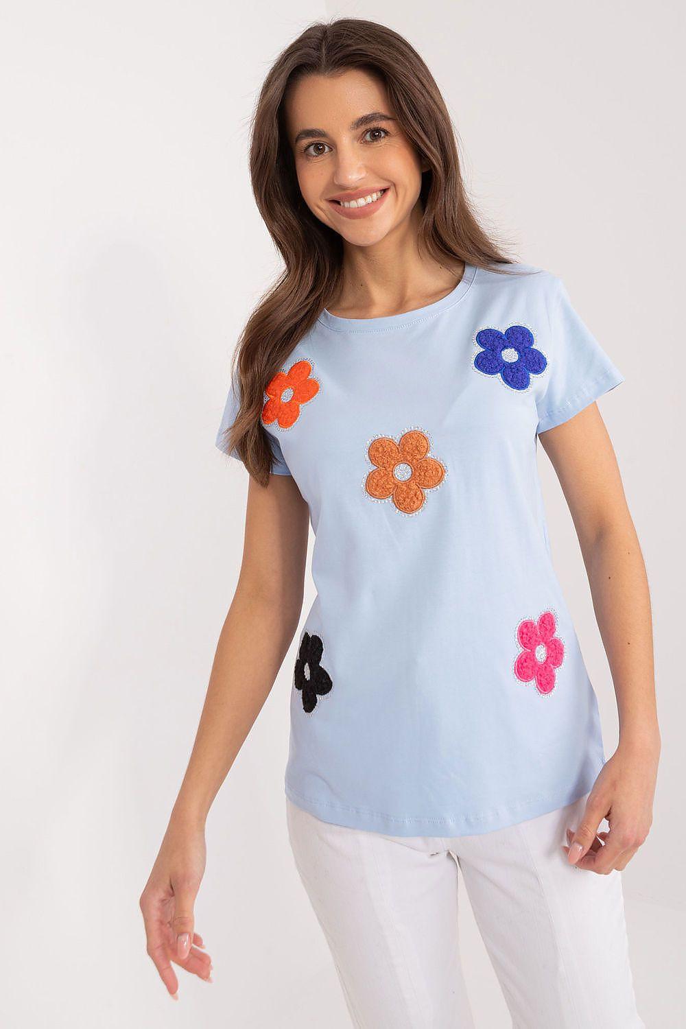 Light blue cotton blouse with short sleeves and colorful floral appliqué details