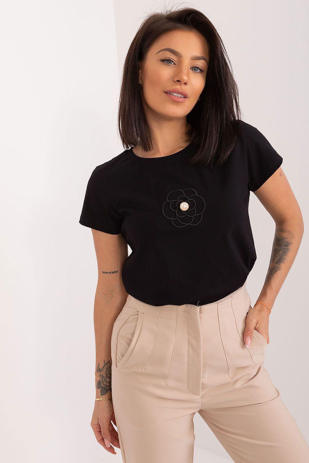 Black cotton blouse with embroidered flower detail and short sleeves