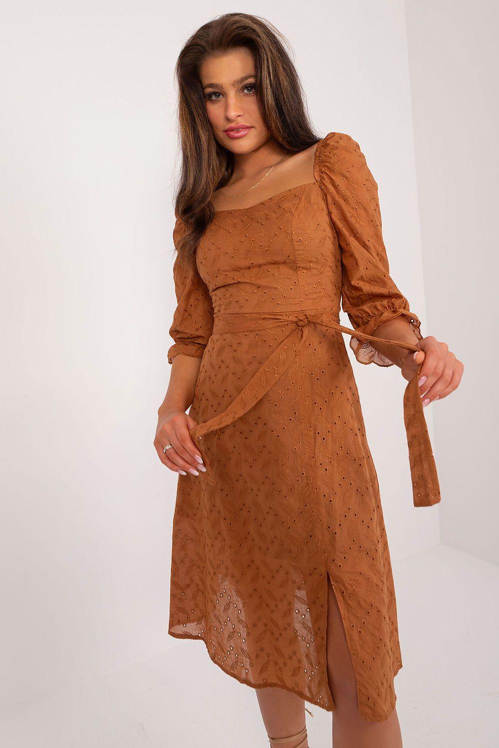 Brown long-sleeve daydress with lace-like pattern, fitted waist and tied sash