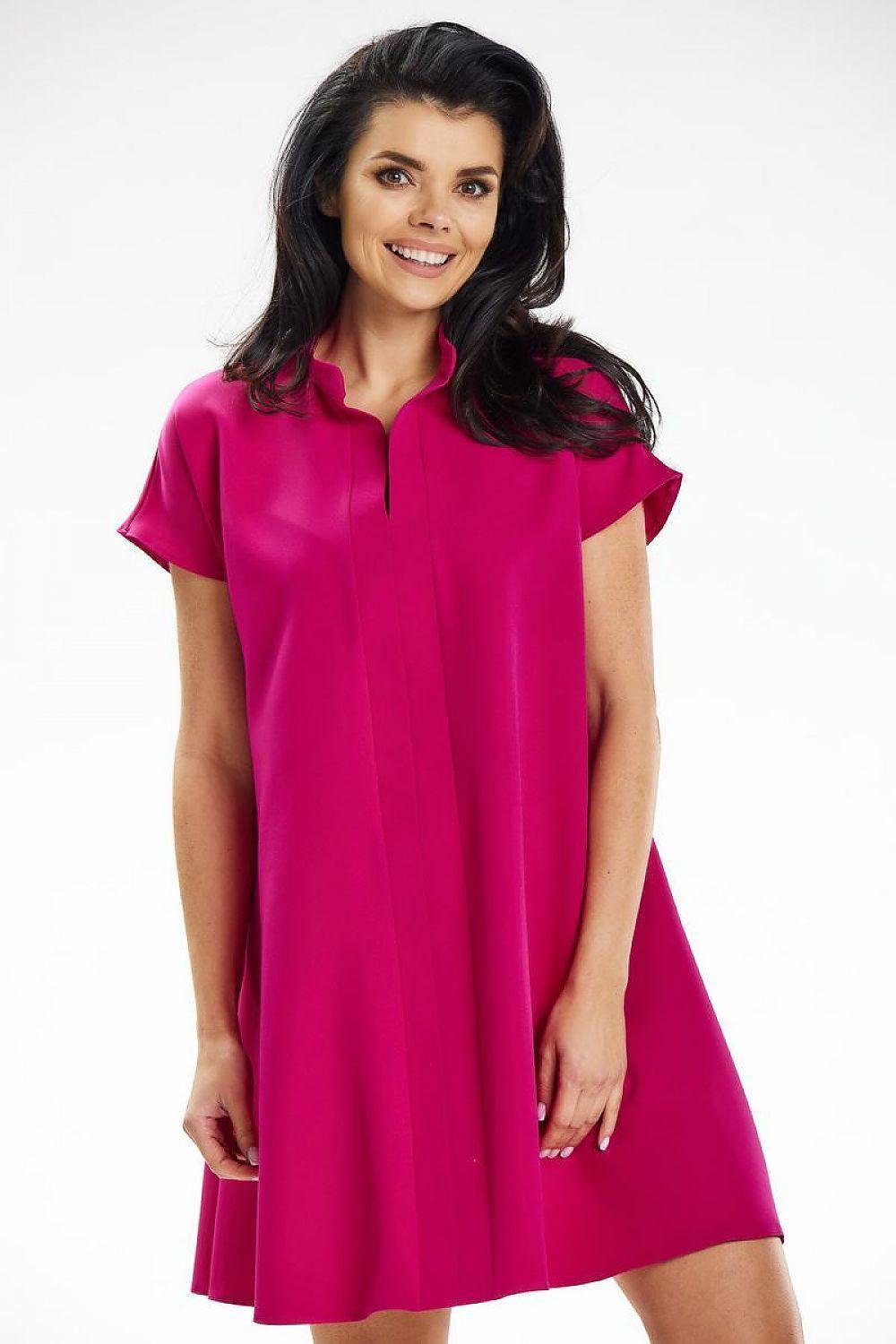 Pink daydress with short sleeves, stand collar, and button-front placket.