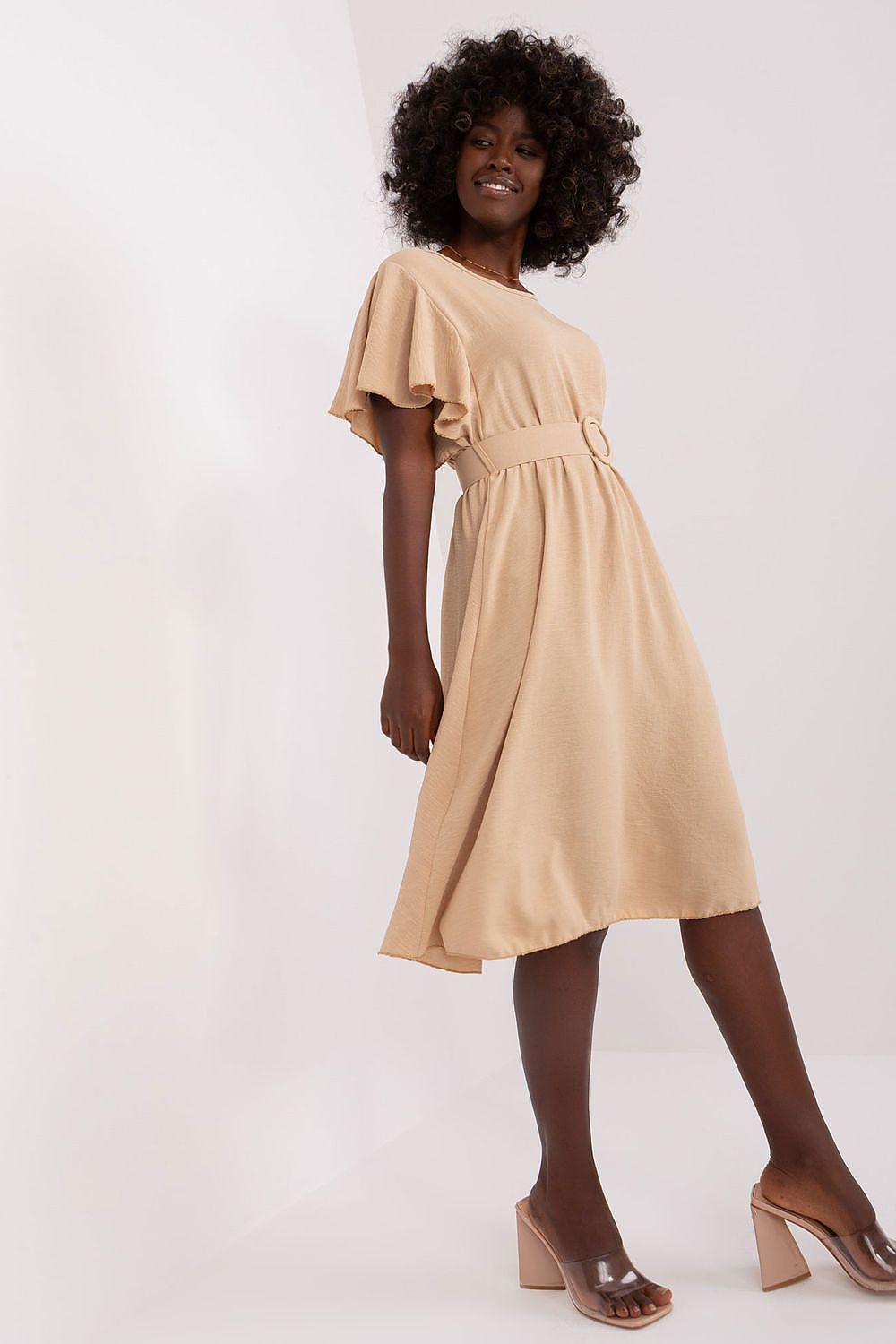 Beige daydress with short sleeves, ruffled yoke, and gathered waist, A-line skirt.