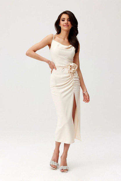 Sleeveless midi cocktail dress in light cream with ruched waist rose applique and front slit