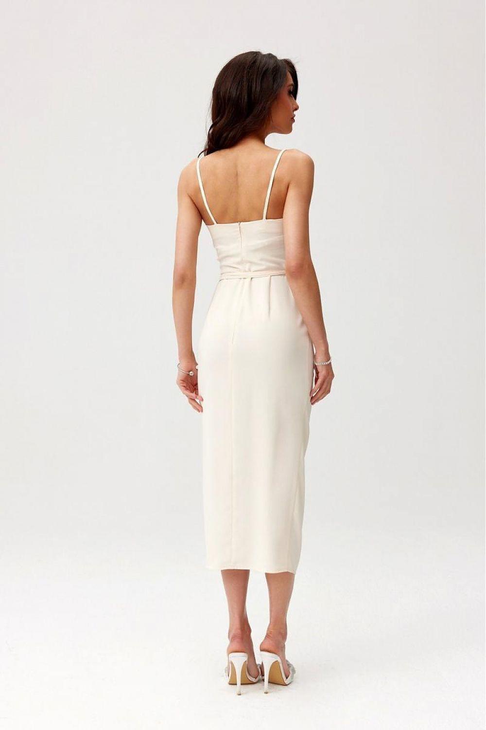 Back view of sleeveless midi cocktail dress in light cream with thin straps and centered seam