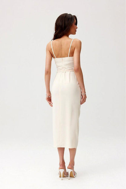 Back view of sleeveless midi cocktail dress in light cream with thin straps and centered seam