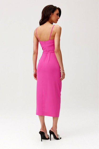 Back view of sleeveless midi cocktail dress in bright pink with scooped back and front slit