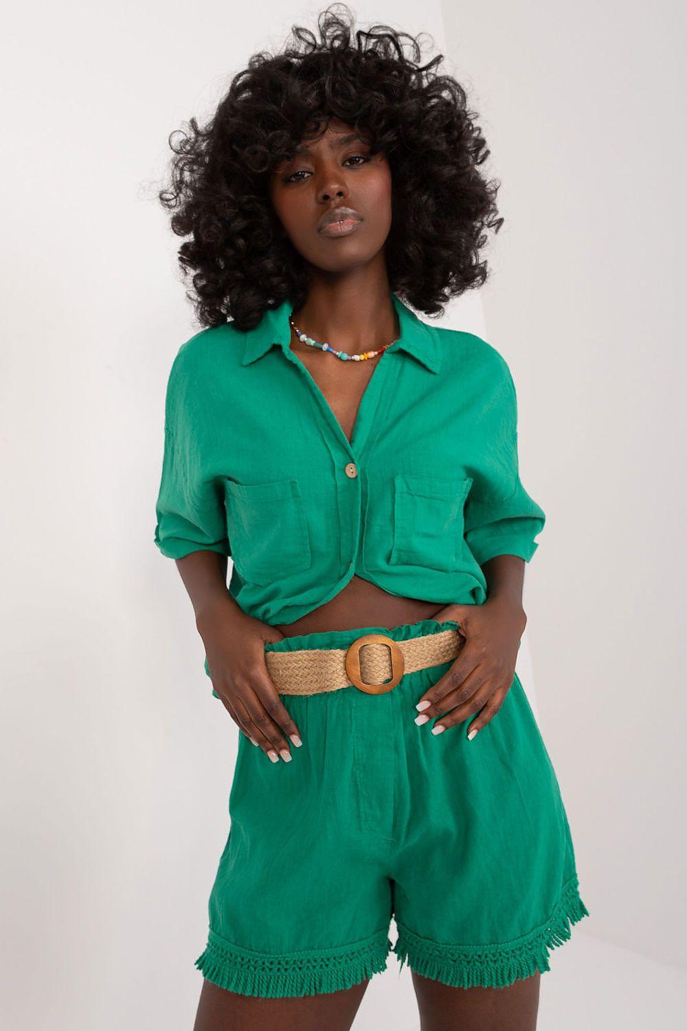 Green linen shorts with drawcord hem, side pockets, and woven belt