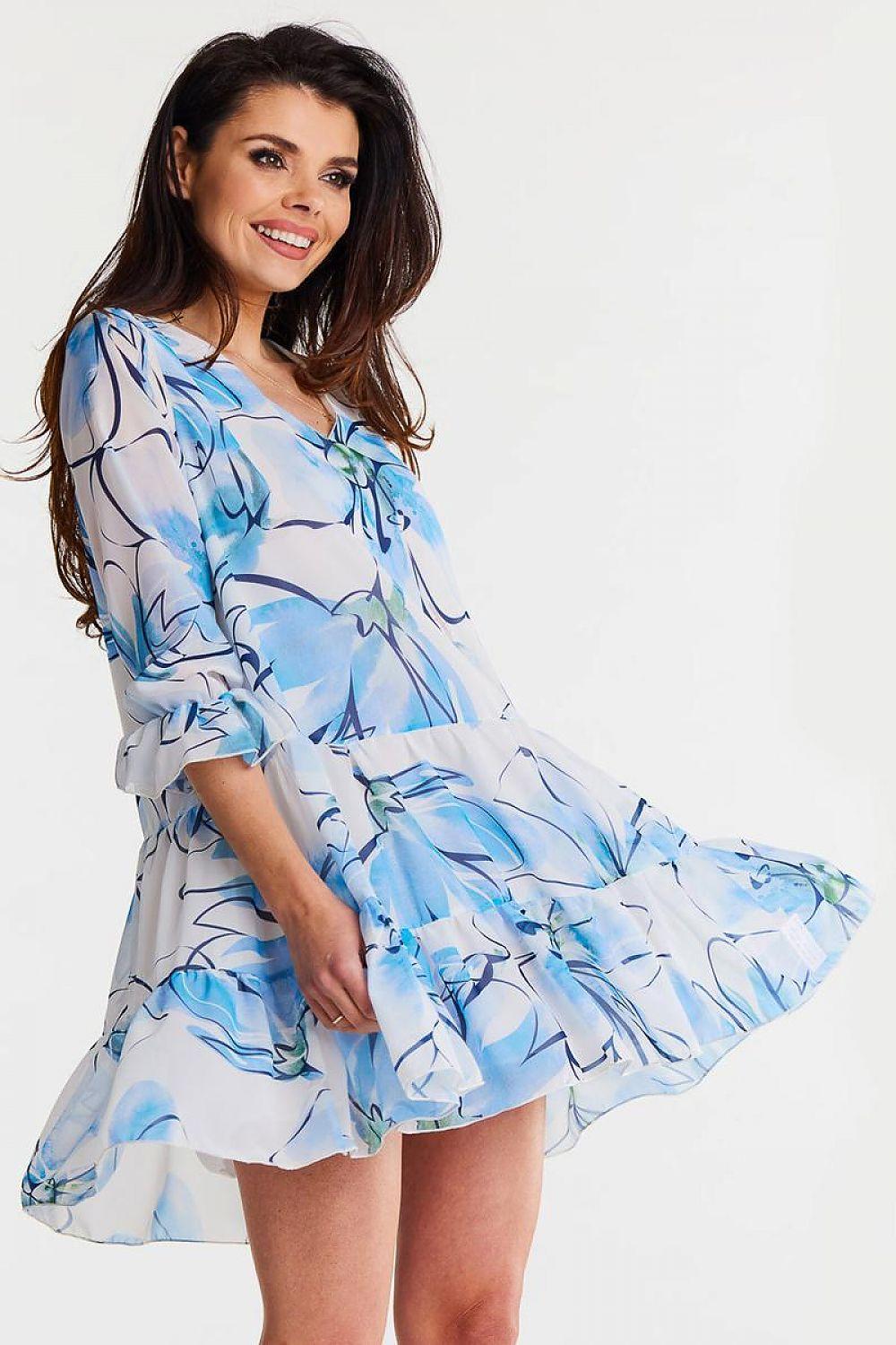 Blue and white patterned day dress with ruffled tiers, flared sleeves and V-neck