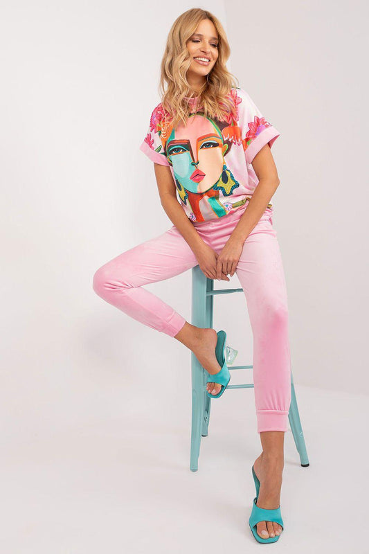 Pink graphic T-shirt and cropped pants set with large teal face artwork