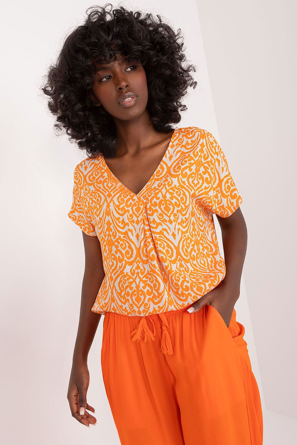 Orange patterned viscose blouse with V-neck and short flutter sleeves