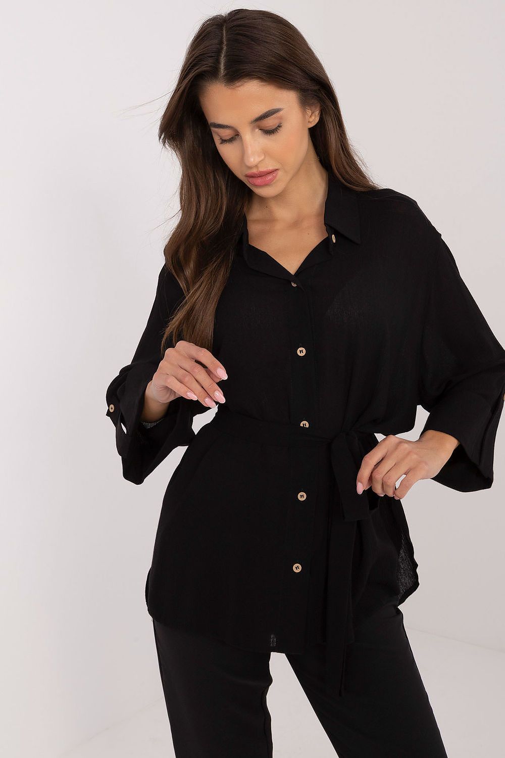 Black tie-waist button-up cotton shirt with collar, long sleeves, and button front