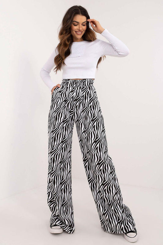 Women’s two-piece set: white long-sleeve top and zebra-print wide-leg pants