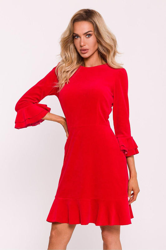 Red long-sleeve daydress with flared ruffle cuffs and tiered hem, fitted waist.