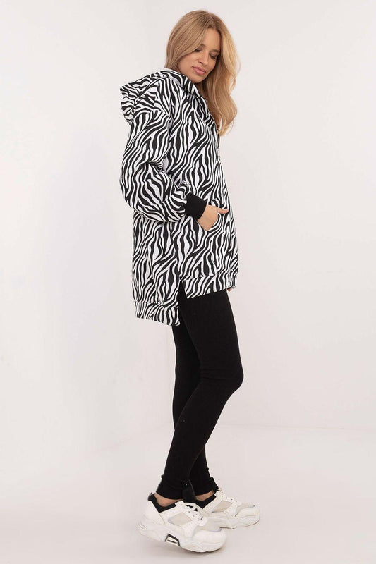Zebra-print hooded jacket with black leggings, full view