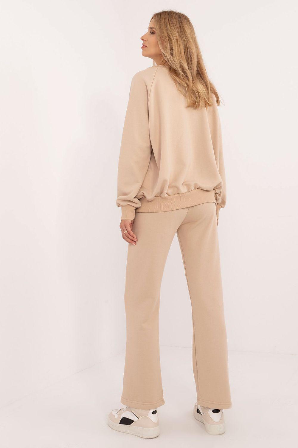 Women’s cotton tracksuit set with long-sleeve top and matching wide-leg pants in light tan