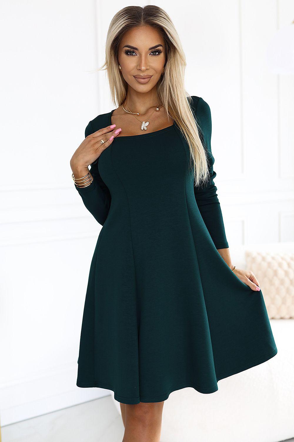Dark green day dress with long sleeves and flared skirt