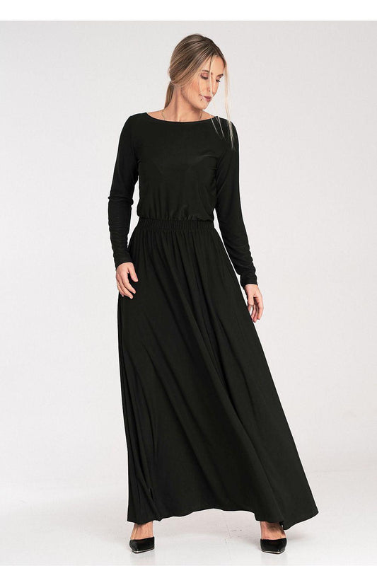 Black daydress with long sleeves, elastic waist, and flowing midi skirt.
