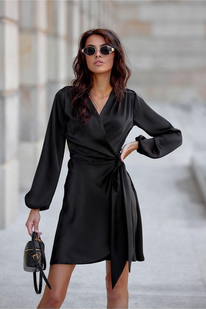 Black satin cocktail dress with V-neck, long puff sleeves, and waist tie wrap front